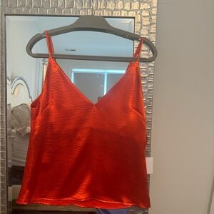 Orange hammered shell; 100% polyester w/ lining.  Perfect alone or under blazer.